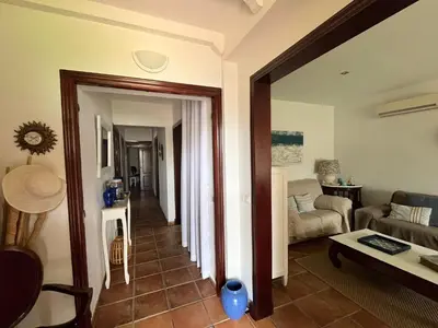 a living room with a couch and a table at VILLA ANDEMAR in Chiclana de la Frontera