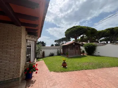 a house with a yard with a smallshed at VILLA ANDEMAR in Chiclana de la Frontera