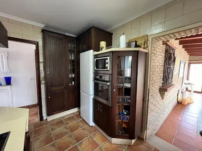a kitchen with a refrigerator and a microwave at VILLA ANDEMAR in Chiclana de la Frontera