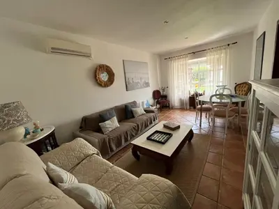 a living room with a couch and a table at VILLA ANDEMAR in Chiclana de la Frontera