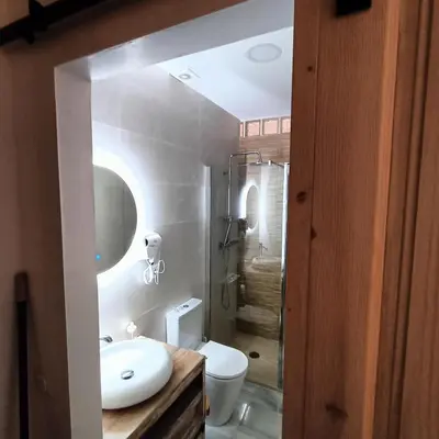 a bathroom with a white sink and a toilet at Jerez Palace House in Jerez de la Frontera
