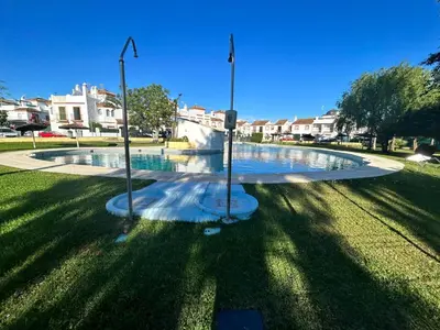a fountain in the middle of a park at Apartamento Empul La Barrosa in Chiclana de la Frontera