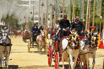 a group of people riding in a horse drawn carriage at La Parra Apartamento in Jerez de la Frontera