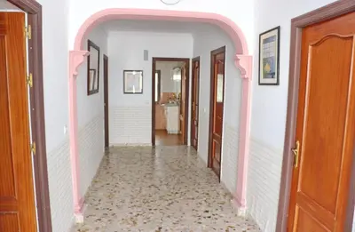 a hallway with an archway in a house at Chalet Blue in Conil de la Frontera