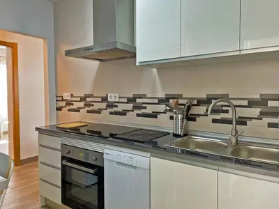 a kitchen with a sink and a counter top at Apartamento Alván - Ole Solutions in Jerez de la Frontera