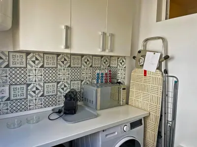 a kitchen with a counter with a mixer and tiles at Apartamento Alván - Ole Solutions in Jerez de la Frontera