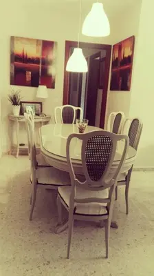 a dining room with a white table and chairs at Centro Sanlúcar Barrameda/Cuesta Ganado in Sanlúcar de Barrameda