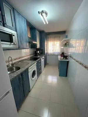 a kitchen with a sink and a washing machine at Centro Sanlúcar Barrameda/Cuesta Ganado in Sanlúcar de Barrameda