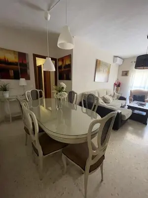 a living room with a table and chairs and a couch at Centro Sanlúcar Barrameda/Cuesta Ganado in Sanlúcar de Barrameda