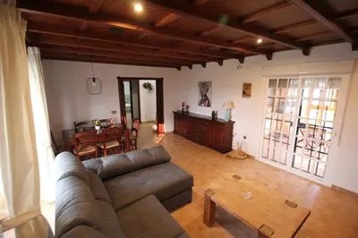 a living room with a couch and a table at LOS ALMENDROS in Chiclana de la Frontera