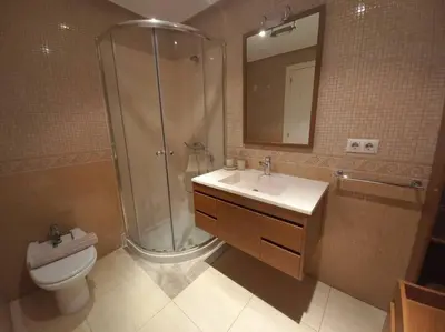 a bathroom with a shower and a sink and a toilet at Cantabrico playa Grupo AC Gestion in Cádiz