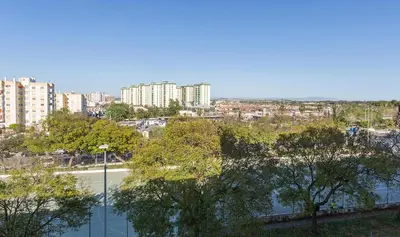 a view of a city with a river and buildings at Luminoso 3 rooms 2 Baños Parking in Jerez de la Frontera