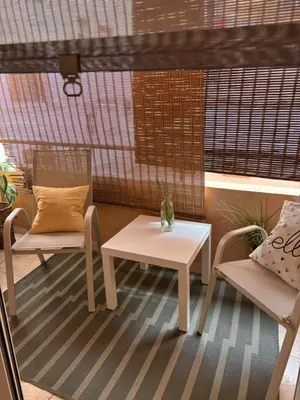 a table and two chairs and a white table and chairs at Casa del mar in San Fernando
