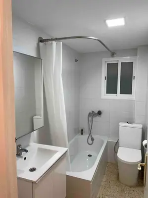 a bathroom with a tub and a toilet and a sink at Casa del mar in San Fernando