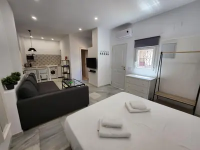 a living room with a couch and a table at Allo Apartments 