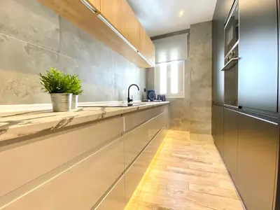 a kitchen with a sink and a refrigerator at People Homes Ponce 13 in Jerez de la Frontera