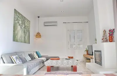 a living room with a couch and a table at Casa Aqua in El Guijo
