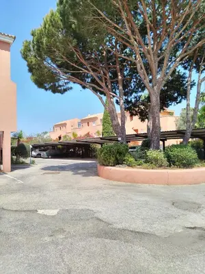 a parking lot with trees and a building at Novo Sancti Petri, con piscina todo el año, La Mariposa by Chiclana Dreams in Chiclana de la Frontera