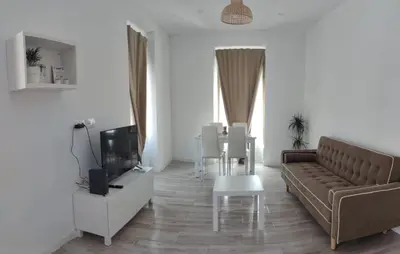 a living room with a tv on a white wall at Apartamento Cerrofuerte in Jerez de la Frontera