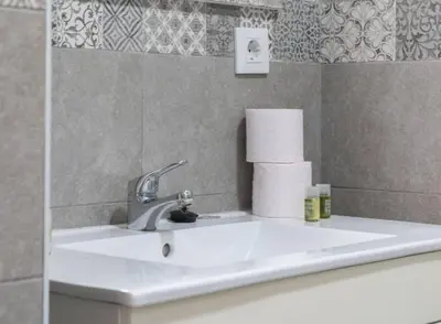 a white sink in a bathroom with at Apartoyou - Centro Histórico in El Puerto de Santa María