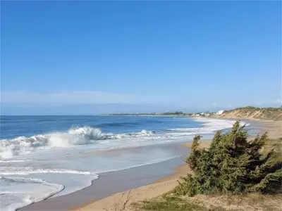 a beach with waves crashing on the shore at Rota Punta Candor Terrace Playa 3 Bajo C in Rota