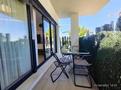 a patio with two chairs and a table on a balcony at Rota Punta Candor Terrace Playa 3 Bajo C in Rota