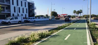 a street with cars parked on the side of the road at Rota Punta Candor Terrace Playa 3 Bajo C in Rota