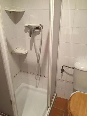 a shower in a bathroom with a toilet at Relaxing Sanlúcar in Sanlúcar de Barrameda