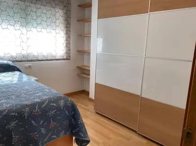 a bedroom with a bed and a dresser and a window at Sensacional piso en San Fernando in San Fernando