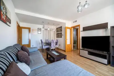 a living room with a couch and a flat screen tv at Sensacional piso en San Fernando in San Fernando