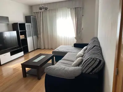 a living room with a couch and a table at Sensacional piso en San Fernando in San Fernando