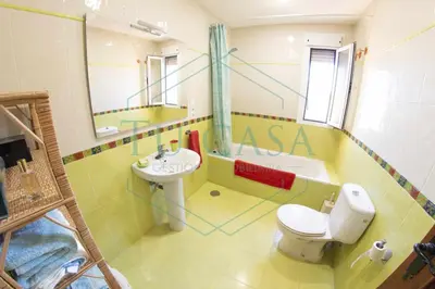 a bathroom with a toilet and a sink at Villa Zahara de 3 habitaciones con Piscina in Cádiz