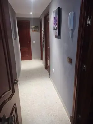 a hallway with a room with a door and a hallwayngthngthngthngthngth at Piso en la Costilla-Rota in Rota