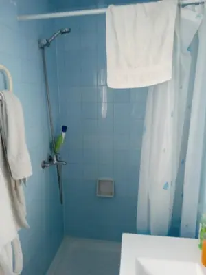 a bathroom with a shower with a shower curtain at Casa luis puerto in El Puerto de Santa María