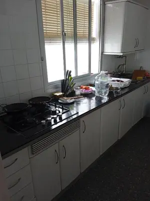 a kitchen with a stove and a counter top at Casa luis puerto in El Puerto de Santa María