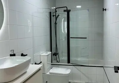 a bathroom with a sink and a shower and a toilet at Apartamento Centro Cabildo Antiguo Convento in Sanlúcar de Barrameda