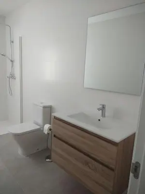 a bathroom with a sink and a toilet at CHALET ARRILUCE Plaza de parking gratis en la playa in Chiclana de la Frontera
