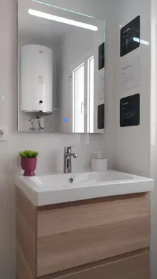 a bathroom with a white sink and a mirror at Sherryflat Fontana in Jerez de la Frontera