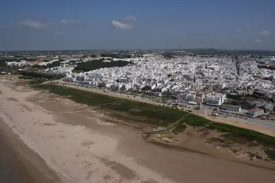 an aerial view of a beach and a city at Alojamiento Rural Al´Mare in Conil de la Frontera