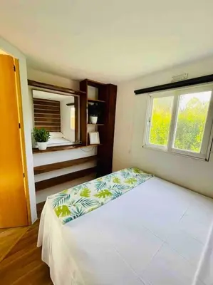 a bedroom with a bed and a window at Alquiler de casa Vacacional in Chiclana de la Frontera