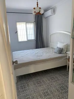 a bed in a bedroom with a window at Casa im andalusischen Look in der Nähe von Chipiona in Costa Ballena