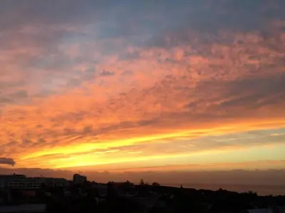 a view of a sunset from a city at Casa im andalusischen Look in der Nähe von Chipiona in Costa Ballena