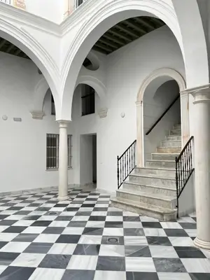 an empty room with a black and white checkered floor at Piso Palacios in El Puerto de Santa María